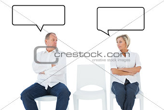 Composite image of upset couple not talking to each other after fight