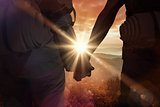 Composite image of hitch hiking couple standing holding hands on the road