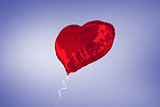 A large red heart balloon