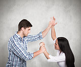 Composite image of aggressive man overpowering his girlfriend
