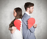 Composite image of side view of young couple holding broken heart