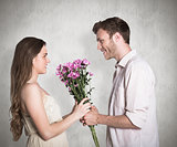 Composite image of side view of couple holding flowers