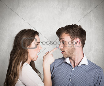 Composite image of casual young couple in an argument