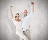 Composite image of smiling couple cheering at the camera