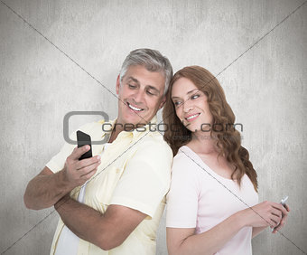 Composite image of casual couples on their phones