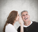 Composite image of woman telling secret to her partner