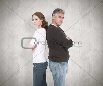 Composite image of casual couple not speaking after fight