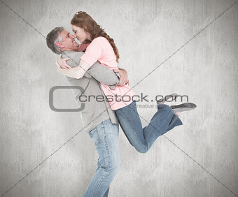 Composite image of casual couple hugging each other