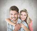 Composite image of attractive couple embracing and smiling at camera