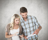 Composite image of attractive couple working out their finances