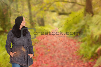 Composite image of woman standing and looking away