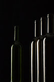 Silhouettes of elegant wine bottles