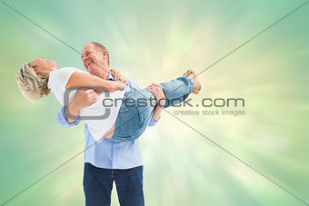 Composite image of mature man carrying his laughing partner