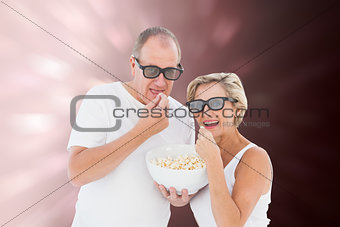 Composite image of mature couple wearing 3d glasses eating popcorn