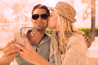 Hip young couple taking a selfie together