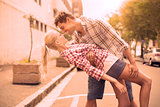 Hip romantic couple dancing in the street