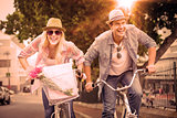 Hip young couple going for a bike ride