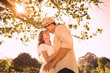Cute couple standing in the park embracing