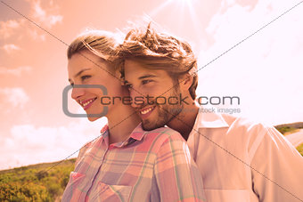 Smiling couple standing outside together
