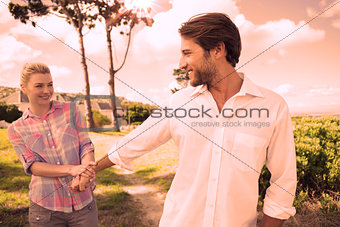 Smiling couple standing outside together in their garden