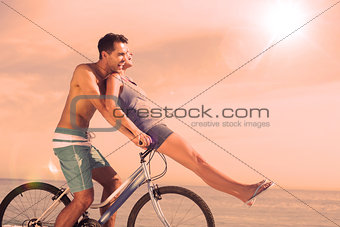 Man giving girlfriend a lift on his crossbar
