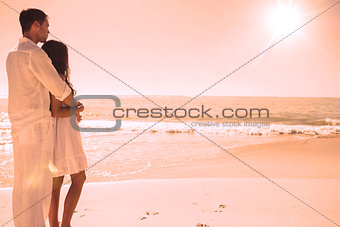 Attractive couple looking out at sea