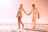 Pretty blonde walking away from man holding her hand