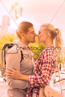 Young tourist couple about to kiss
