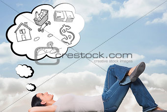 Composite image of young woman lying on floor thinking
