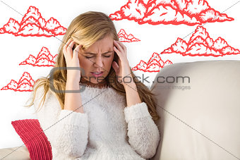 Composite image of woman with headache sitting on sofa