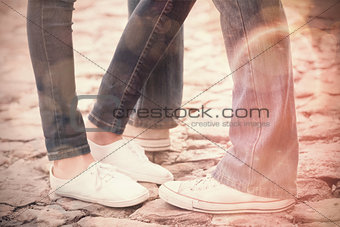 Couple in jeans standing on path