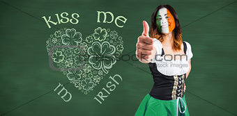Composite image of irish girl showing thumbs up