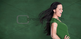 Composite image of brunette in green tshirt