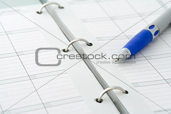 Ballpoint pen on notebook