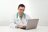 doctor using his laptop computer