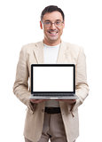 handsome man showing laptop with blank screen