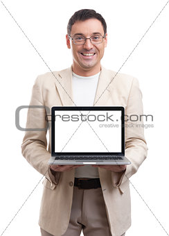 handsome man showing laptop with blank screen
