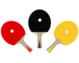 three table tennis rackets