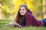 Female Teen on Ground Studying