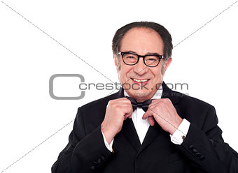 Cheerful old man in classical tuxedo
