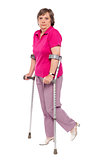 Unhappy handicapped woman with crutches