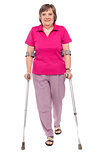 Full length portrait of an injured senior woman