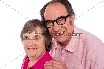 Closeup portrait of smiling aged couple