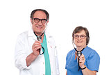 Smiling aged male and female doctors