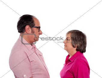 Looking into each others eyes. Aged love couple