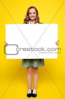 Girl showing white blank billboard