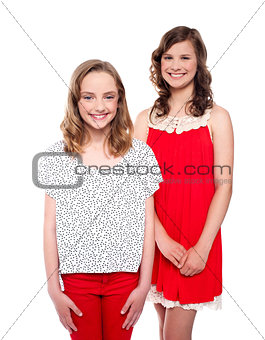 Lovely girls wearing beautiful trendy dresses, posing together