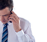 Cropped image of man talking on cell phone