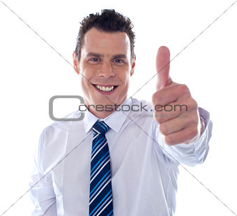 Corporate man showing thumbs up