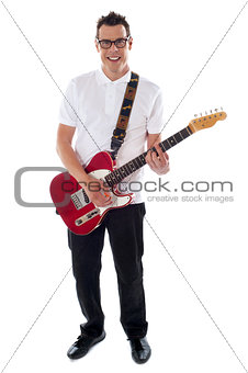 Full shot of a young man with guitar